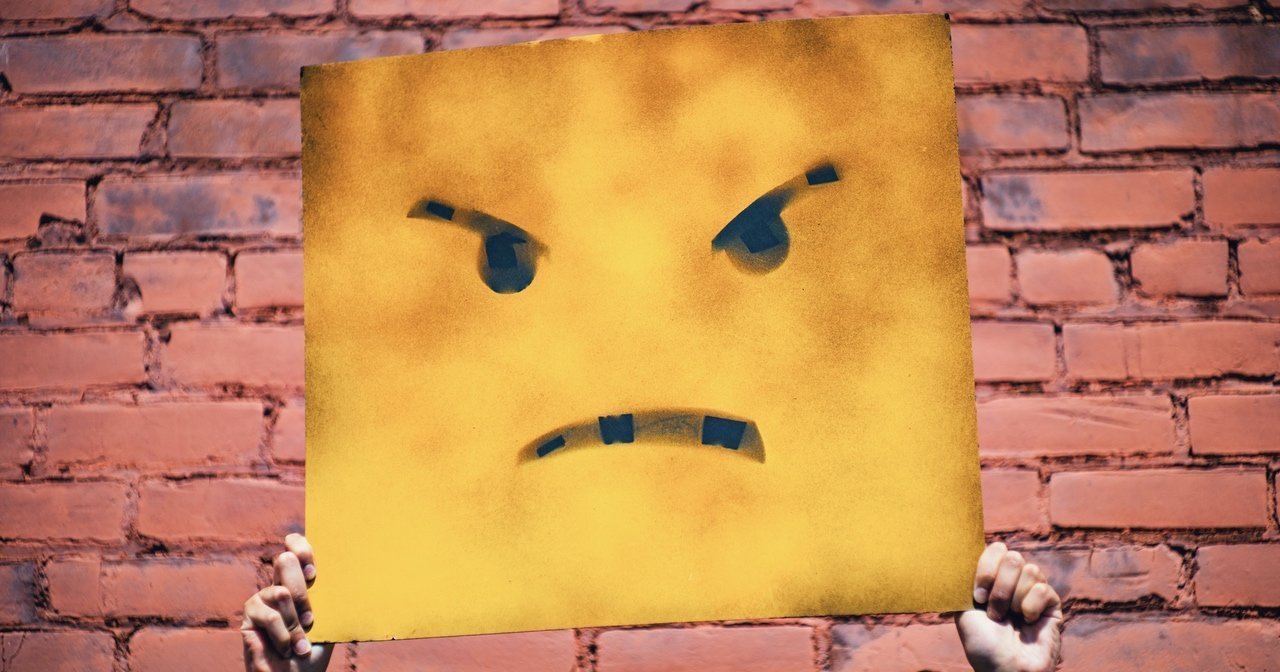 emoji sign with a scowl