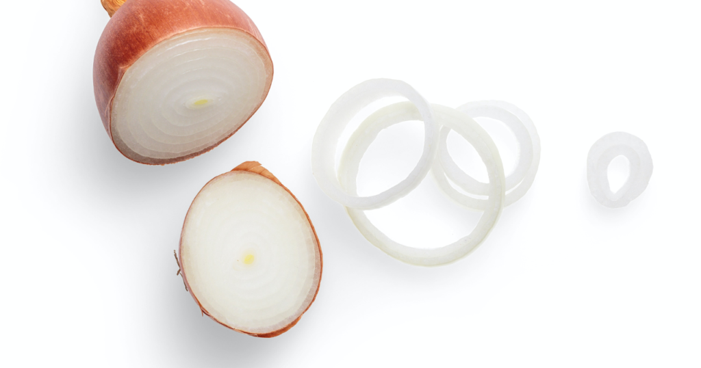 Sliced onion on a white counter