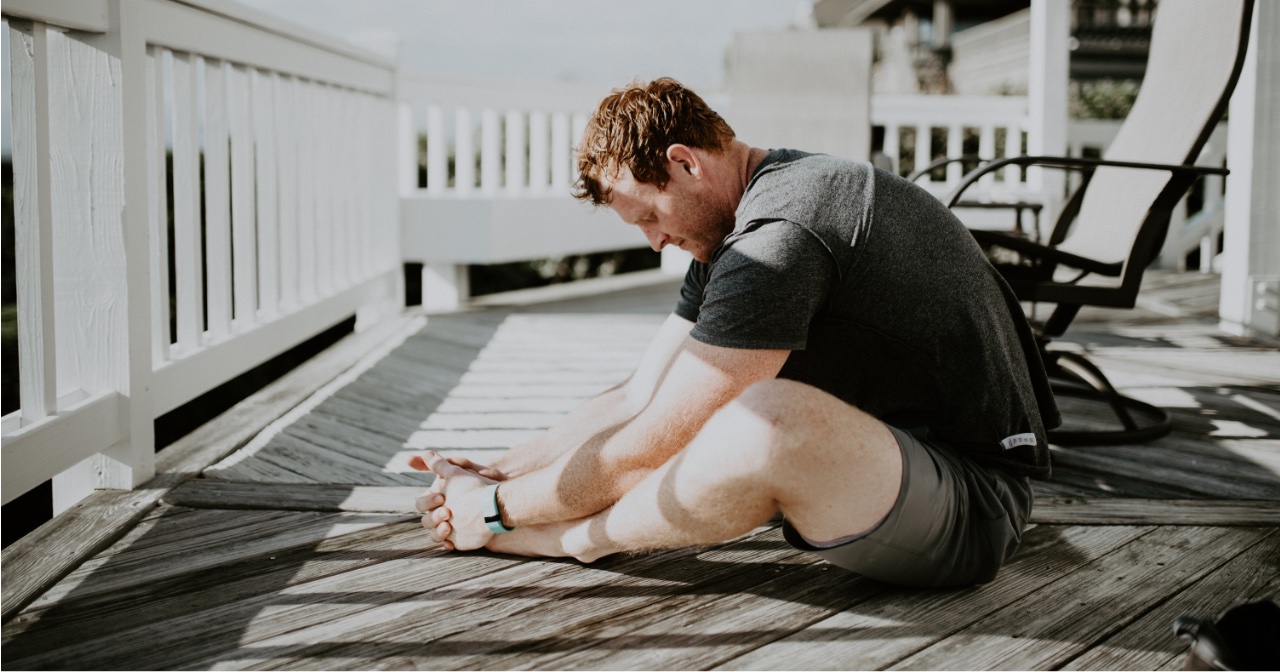 Man stretching on his deck