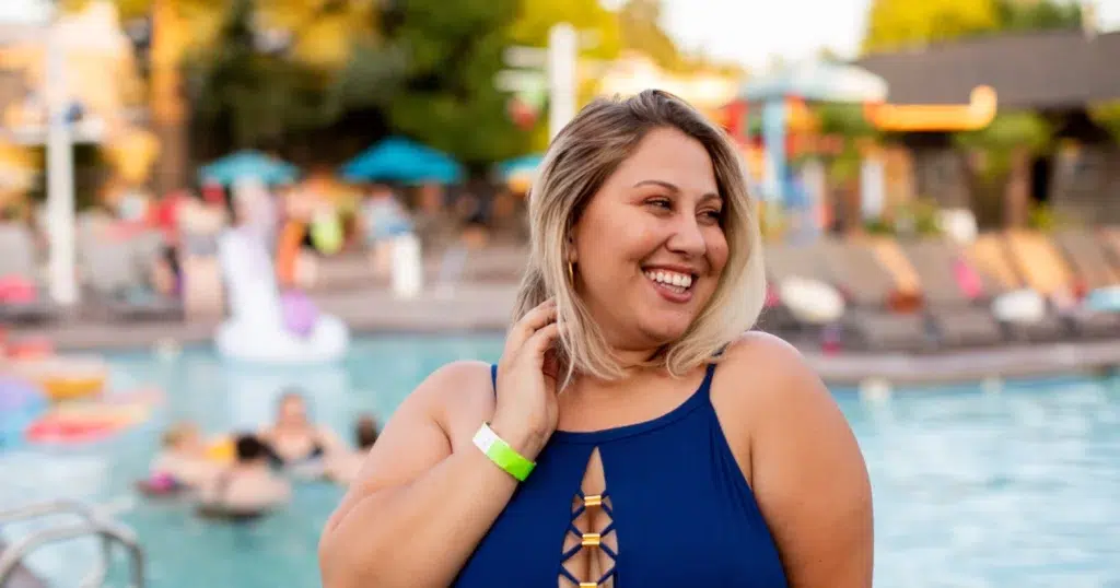 Woman smiling at outdoor pool