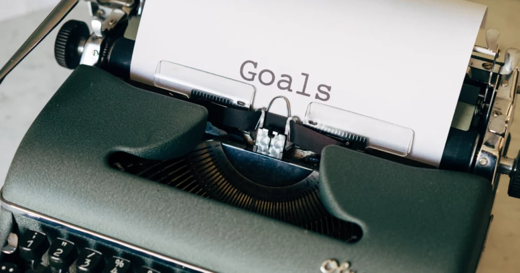 Typewriter with "Goals" on headline