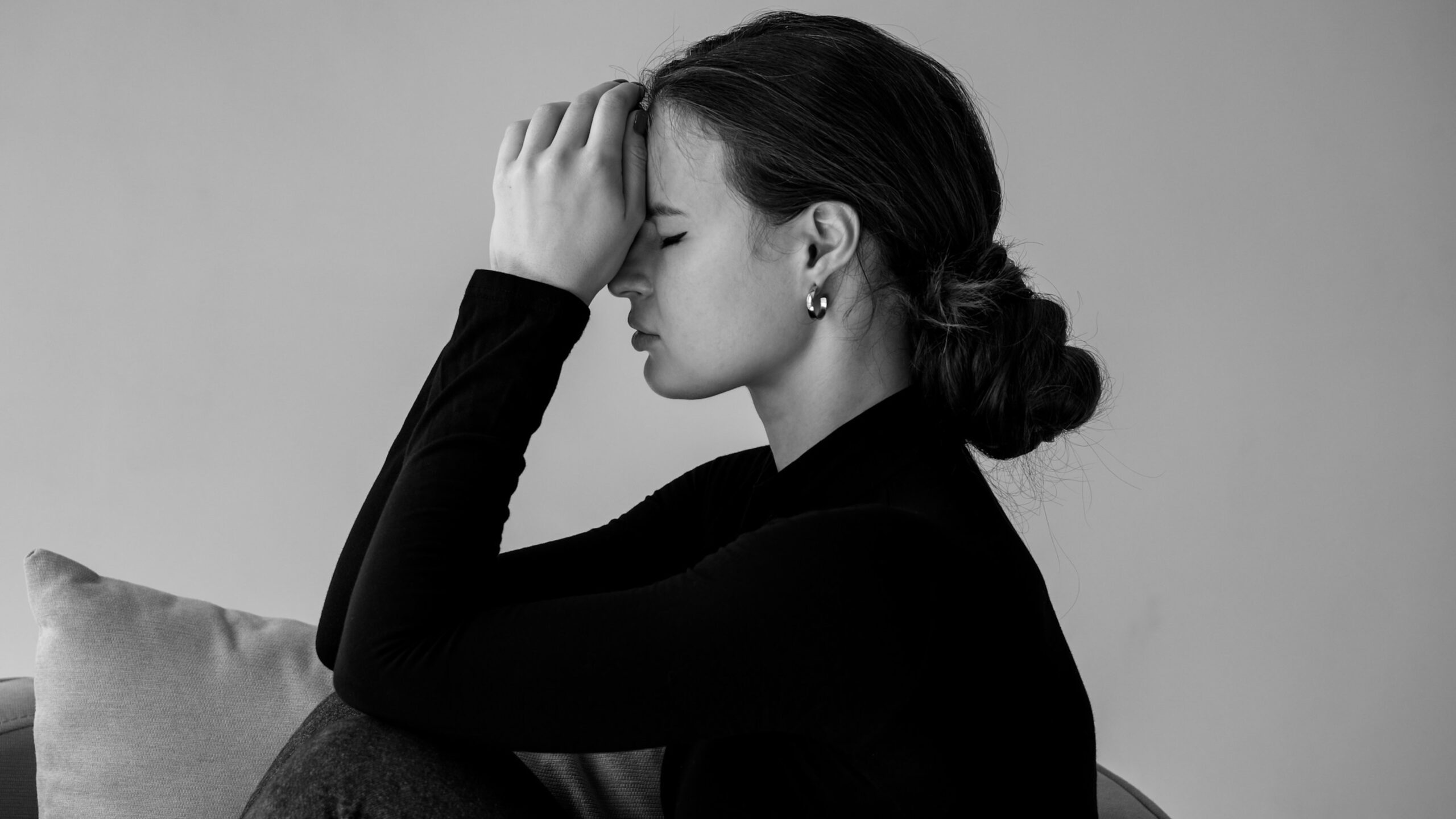 Black and White photo of woman thinking